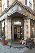 Open door to Edwardian antique shop in West Sussex England UK