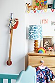 Hobby horse and wooden chest of drawers in child's room of London family home,  England,  UK