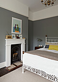 Double bed with Victorian fireplace in contemporary London home   England   UK