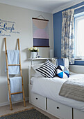 Nautically themed single bedroom with storage drawers in Bolton home,  Greater Manchester,  England,  UK