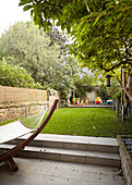 Hammock on patio in garden of family townhouse  London  England  UK