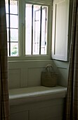 Upholstered window seat with shopping basket