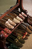 Ladies shoes on Victorian mahogany shoe rack