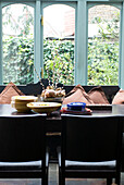 Tableware and Christmas catkins in Oriental dining room