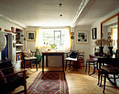 Sunlit window of whitewashed cottage interior