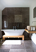 Modern bathroom with free standing bathtub