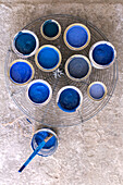 Cans with blue paint