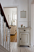 Cupboard and staircase in hallway