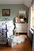 Metal framed bed with hat boxes and painted chest of drawers