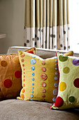 Assorted cushions in West London townhouse England UK