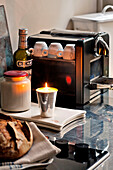Candlelit coffee machine in Paris apartment, France