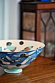 Blue hand painted bowl in Bovey Tracey family home, Devon, England, UK