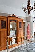 Antique wooden wardrobe in bedroom of Middlesex family home, London, England, UK