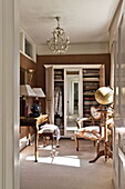 Antique wooden furniture and wardrobe in dressing room of Bury St Edmunds country home, Suffolk, England, UK