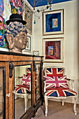 Union Jack chair with display cabinet in London home, England, UK