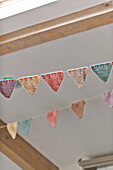 Handmade bunting and ceiling detail in Blagdon home, Somerset, England, UK