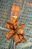 Gift-wrapped Christmas present in Crantock home Cornwall England UK