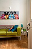Beatles artwork above lime green sofa in living room of Penzance family home Cornwall England UK
