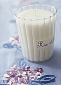 Candle on tablecloth with embroidery