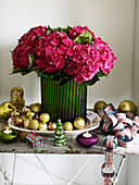 PInk hydrangea in green vase with gold baubles and Union Jack streamer
