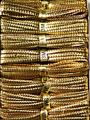 Stacked lengths of three metre gold string