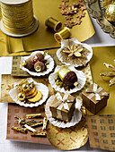 Assorted Christmas decorations on seashells with wrapping paper