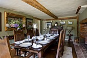 Antique dining room table and chairs in timber framed cottage, Grafty Green, Kent, England, UK