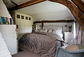 Built in storage in bedroom of beamed Sandhurst cottage, Kent, England, UK