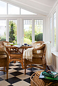 Wicker furniture on conservatory of Smarden home Kent England UK