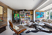 Bookcase and furniture with cowhide rug in Rye East Sussex UK