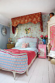 Contrasting florals with upcycled wardrobe in Tenterden bedroom Kent UK