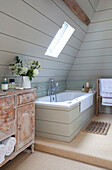 Light blue panelled bathroom in timber framed Kent cottage, England, UK