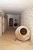Large pottery urns in exposed stone hallway, holiday villa, Republic of Turkey