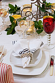 Christmas place setting with red wine glass and napkin