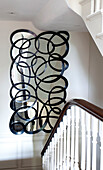 Black outline on staircase mirror, contemporary London home, UK