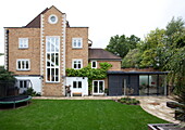Lawned garden exterior to contemporary London home, England, UK
