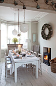 White dining room set for Christmas dinner in London home, England, UK