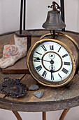 Antique alarm clock on tabletop in London townhouse, England, UK