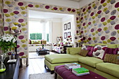 Floral print wallpaper in double room of contemporary London townhouse, England, UK
