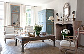 Vintage furniture in terracotta tiled living room of Mougins apartment, Alpes-Maritime, South of France