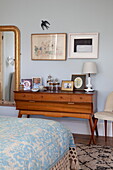 Vintage dressing table with gilt framed mirror in bedroom detail of Kent family home England UK