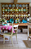 Crockery on wooden kitchen dresser of London kitchen England UK