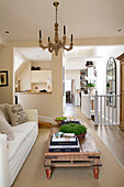 Open plan living room with staircase banister in Twickenham townhouse, Middlesex, England, UK