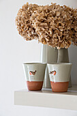 Dried hydrangea with ceramic cups in Suffolk farmhouse,  England,  UK