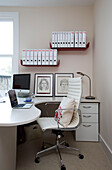 White leather chair in home office of contemporary London home   UK