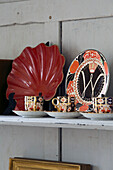 Decorative vintage ceramics on shelf in Pewsey country house Wiltshire England UK