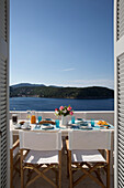 Sunlit terrace with Aegean sea in Greek villa on island of Ithaca