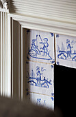Blue and white tile detail in Victorian terraced house London England UK