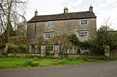 Detached stone facade of Gloucestershire farmhouse England UK