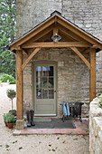 Wellington boot rack in entrance porch of Gloucestershire home England UK